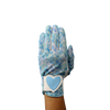 Ladies golf glove with a white and teal tropical frond design