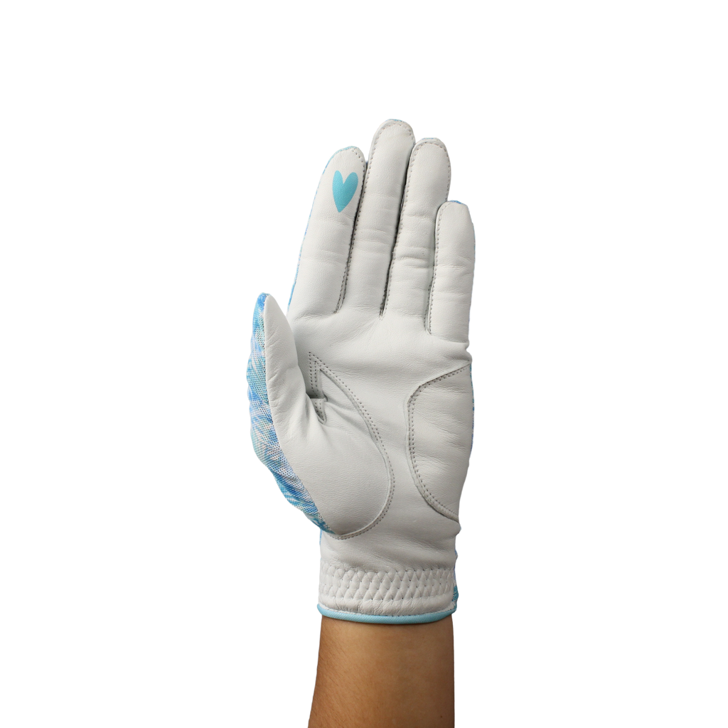 Ladies golf glove with a white and teal tropical frond design