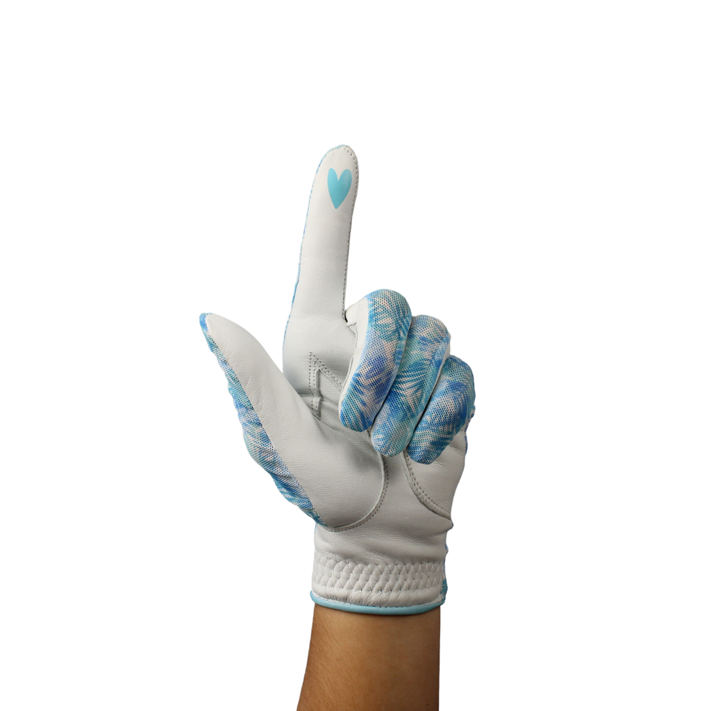 Ladies golf glove with a white and teal tropical frond design